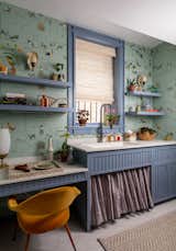 The sizable laundry room was taken over by Fairfax Dorn Projects, and uses Jennifer Shorto’s new "Pompeii" wallpaper.