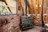 Before: Fireplace of Pine Hill A-Frame by Studio Bunkley