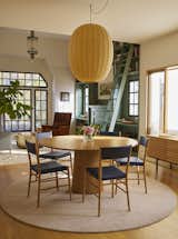 In the newly opened dining area, a table from Pinch is joined by chairs from The Future Perfect and a rug designed by Bestor and Cheung for the Rug Company. The pendant light and the sideboard are both from A+R.