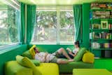 Guido and his girlfriend, Stefania, relax on a Monopoli couch from Désirée in vibrant shades of green. “When Stefano chose the wall colors, I thought, well, at the worst we’ll have to repaint,” says Guido. “Now I wouldn’t change it.”