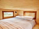 Mezzanine bedroom in wooden tiny home in Sintra, Portugal