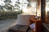 Two of the three private DULC cabins have outdoor spa baths. All three have spacious decks.  Photo 5 of 8 in One Night in a Secluded Cabin Deep Within the Australian Bush