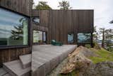 Geometric decks hug the home’s exterior, encouraging indoor/outdoor living.