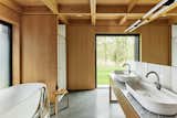 Bathroom in Black House Farm by Robin Lee Architecture