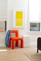 Maldonado says one of her favorite chairs in the hotel is this neon-colored one by TRNK. The New York studio’s palette is typically more neutral, but Maldonado wanted something that simultaneously felt “refined and playful.” A side table by local artist Elizabeth Loux complements simple artwork from local painter Scott Vradelis.  Photo 7 of 10 in At Yowie Hotel, an Overnight Stay Is Also a Crash Course in the Best Design You’ve Never Heard Of