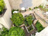 The 60-room Parisian design hotel includes a duplex terrace and private shaded rooftop garden revegetated by local urban gardening collective Merci Raymond.  Photo 4 of 7 in One Night in a Parisian Hotel With a Hidden Roof Garden and Pops of Postmodern Decor