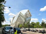 The French museum Fondation Louis Vuitton, designed by architect Frank Gehry, organizes two temporary exhibitions each year, one focused on modern art, and the other on contemporary art.  Photo 5 of 7 in One Night in a Parisian Hotel With a Hidden Roof Garden and Pops of Postmodern Decor