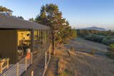 With ocean and mountain views, the elevated home is a modern coastal refuge.