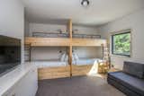 One of the three bedrooms features two sets of custom bunk beds.