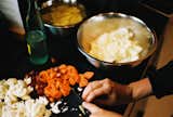 Margaret preps vegetables for Japanese curry on Monday night.  Photo 6 of 11 in One Night in a Tiny Cabin Designed for Remote Work in the Mountains of Southern California