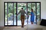 The Marvin Elevate Sliding Door functions as a large window that you can also walk through onto the 14-foot-high open-air porch.