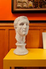 A bust of Julius Caesar lends the library a historical air.