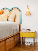 The “wiggles” repeated on the bed frame, side table, and vanity, all designed by Muza, “represent the continuity of dreams and desires,” says Syla.