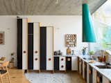 When Ana’s design team at Fala Atelier first proposed blocky kitchen cabinets with dramatic stripes, Ana hesitated. “I thought it would be too much,” she says. “But it’s not. It is incredible, and it is very elegant.” Fala’s Filipe Magalhães says the plays of scale and direction in the house’s patterns make the modest spaces feel grander and create a visual rhythm.