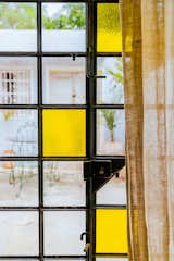 García added yellow panes to the original glass door leading to the terrace.