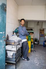 Portrait of Andu Masebo standing in his London workshop.