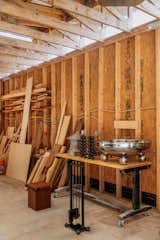 Furniture pieces by Muhly furniture studio are displayed on workbench in workshop in Fredericksburg, Texas