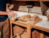 Jason Lewis, founder of Offcut, organizes material wood samples blocks at his Chicago woodshop.