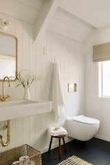 Contrasting the downstairs bath, the one in the loft is finished in mostly white.  Photo 20 of 321 in Bathrooms by Nick Brown from Budget Breakdown: A Bay Area Couple Turn an A-Frame Cabin Near Yosemite Into a $600-a-Night Rental