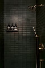 Black tile covers the downstairs shower.  Photo 3 of 16 in Architectural_Likes by Mary Guard from Budget Breakdown: A Bay Area Couple Turn an A-Frame Cabin Near Yosemite Into a $600-a-Night Rental