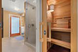 Just past the living area, an authentic Finlandia sauna offers a spa-like experience.
