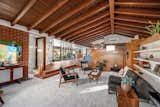 Original wooden beams stretch across the vaulted ceiling capping the main living areas.  Photo 4 of 11 in John Lautner’s Legendary Alexander House Hits the Market for $3.4M