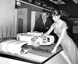 Walt Disney and “Housewife of Tomorrow” Pat Otis unveil the scale model of Monsanto’s House of Tomorrow at the Seventh National Plastics Exhibition at New York's Coliseum in 1956.  Photo 2 of 5 in The Legacy of Disney’s Monsanto House of the Future