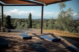 <span style="font-family: Theinhardt, -apple-system, BlinkMacSystemFont, &quot;Segoe UI&quot;, Roboto, Oxygen-Sans, Ubuntu, Cantarell, &quot;Helvetica Neue&quot;, sans-serif;">An outdoor yoga deck tucked behind the San Michele pool overlooks an olive grove.</span>  Photo 8 of 11 in One Night in a Tuscan Estate Reborn as a Hotel With an Artist Residency