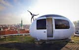 Exterior, Tiny Home Building Type, Prefab Building Type, Curved RoofLine, and ADU Building Type In case of hard-to-reach locations (like this rooftop in Bratislava), the Ecocapsule® can be airlifted by two hooks built into its frame.  Photo 10 of 10 in This Space-Age Pod Wants to Be Your New ADU, Office, or Off-Grid Micro-Home