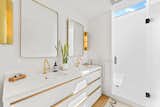 In the bathroom, an expansive clerestory window stretches above the shower, infusing the space with ample natural light.  Photo 9 of 12 in In Santa Barbara, a $5M Floating Home Is Looking for Its Next Captain