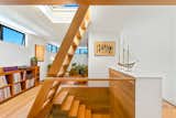 A white-oak staircase connects the main living areas with the bedroom on the upper level.  Photo 7 of 12 in In Santa Barbara, a $5M Floating Home Is Looking for Its Next Captain
