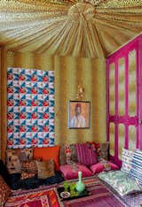 Franco-Iranian interior designer Maryam Mahdavi covered every last inch of the tented sitting area in this Paris apartment with bold colors and patterns.