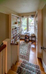 Mikiten added bookshelves in the existing stair landing.
