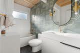 The home’s two bathrooms are fitted with designer fixtures and contemporary tile.