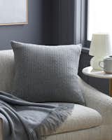 Outfit any couch with Quince’s collection of affordable cashmere pillow covers and throws, complete with a modern cable-knit design.