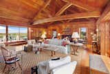Wrapped in wood from floor to ceiling, this living area captures striking views across Lake Tashmoo.