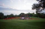 Families gather between Studio Zewde’s <i>Echoes of the Hill</i> and the nearby hillside in <i>Mill Race Park</i> (1993).  Photo 3 of 8 in How This Indiana City Is Trying to Redefine Architecture—and Itself