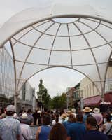 PAU’s structure, <i>InterOculus</i>, sits at a popular intersection in Columbus’s downtown area. <i>The Commons</i>, a community center with a rich architectural history, stands beside it.  Photo 5 of 8 in How This Indiana City Is Trying to Redefine Architecture—and Itself