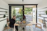 The flexible washitsu room in Cutwork’s modular prefab PolyRoom for Bouygues Immobilier with bespoke dining table, railing system, and a planted living balcony,