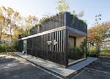 Cutwork’s modular prefab PolyRoom for Bouygues Immobilier with charred and blackened  Japanese shou sugi ban wood siding and a planted rooftop.