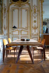Jean Prouvé’s S.A.M. table No. 506 is joined by four Métropole No. 305 chairs in this dining set offered by Galerie Patrick Seguin.