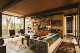 Wood-paneled ceilings complement the exposed beams spanning the home's entire width.