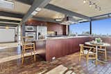Expansive glazing spans the open kitchen, inviting warm sunshine inside while also framing striking views of the San Francisco Bay and surrounding greenery.  Photo 4 of 11 in Dave Brubeck’s Cantilevered Midcentury Home Lists to the Tune of $3M