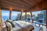 Each of bedroom captures sweeping views of the coastline and the surrounding treetops.