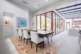 "As you enter, you'll immediately notice the glass wall of doors which completely opens up to the outside, seamlessly merging indoor and outdoor living," notes the agent.