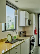 Christian upgraded his kitchen with quartz countertops that he found at a local scrapyard and added customized closet units from Ikea.