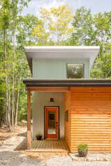 Even with multiple structures across their 10-acre property in Maine, Diana Arcadipone and Scott Berk only had one bathroom. This 560-square-foot guesthouse by architect Leslie Benson gives them a second, as well as space for visiting family and friends.  Photo 2 of 11 in Cabin by Karen Henricks from Our Top Budget Breakdowns of the Year, From $46K to $836K