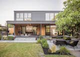 Connect Homes prefab prefabricated Designer Series home house in Walnut Creek, California, with landscaped backyard, covered porch, and wood and metal siding.