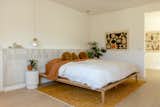 When designing the bedrooms, Venea stressed that it was very important for the family to feel like they were one with the earth, and she used organic materials and warmer colors to emulate that feel. Behind the bed is a ledge created with Zellige tiles to mimic a tiled headboard. “It is beautiful, but it's perfectly imperfect as I tell people,” says Venea of the hand-cut tiles. “I really think it goes well with the desert. It's an earthy material. We incorporated tile in a lot of places that people don't normally do.”