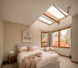 Large windows and skylights introduce ample natural light throughout the interiors.